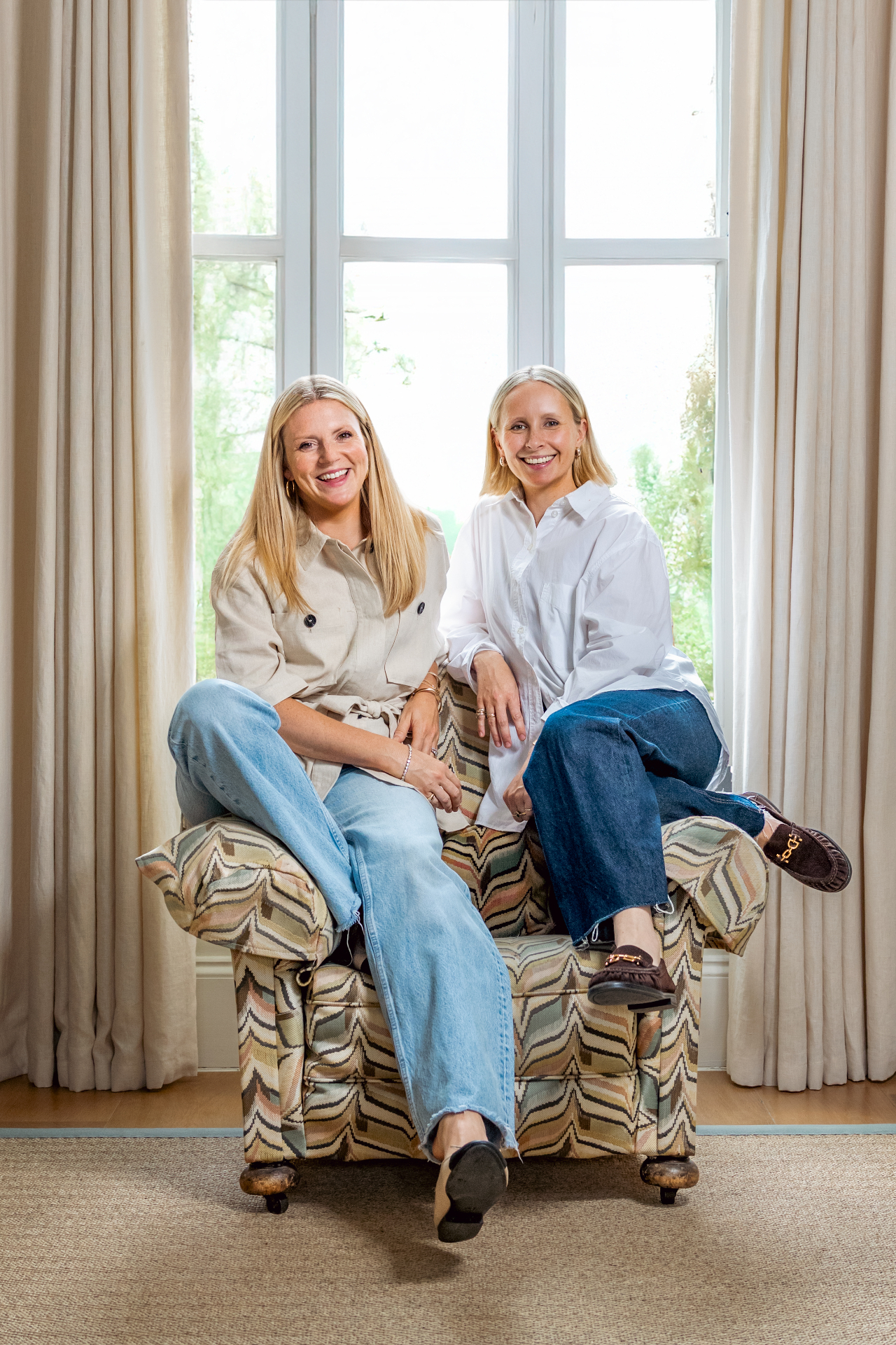 Kate and Jane, founders of Maison Edit, seated together by a window